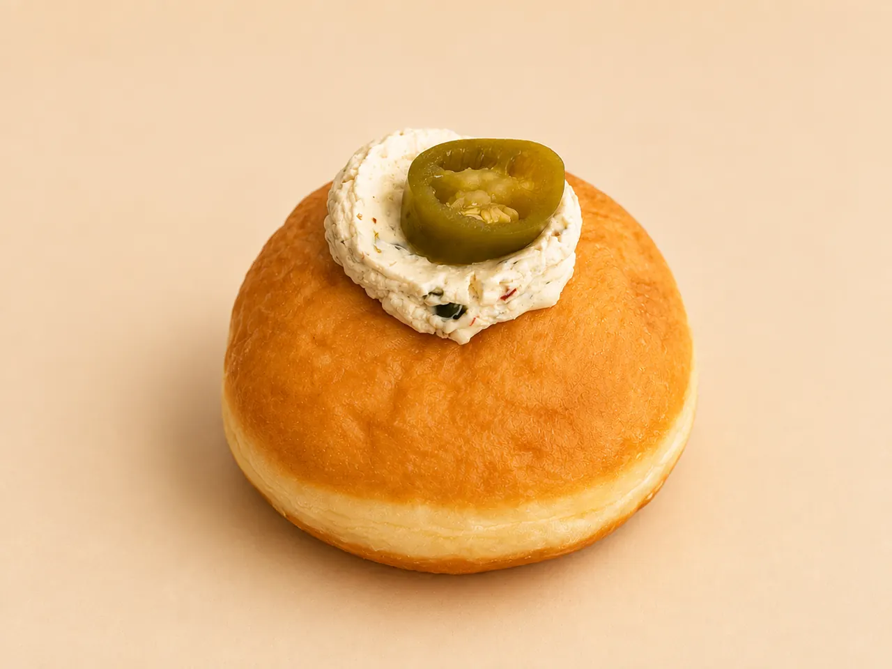 Jalapeño Cheddar Bomboloni, our savoury one: sharp cheddar and a slow jalapeño warmth.